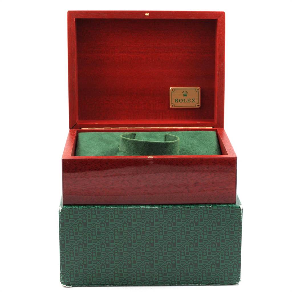 The image shows an open Rolex watch box with a green interior, presumably for the Yacht-Master model.