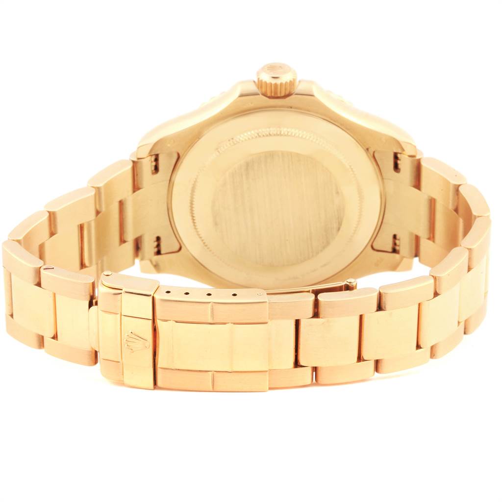 The image shows the backside and bracelet of a Rolex Yacht-Master 16628 Men's Yellow Gold White Dial 16628 Men's Yellow Gold White Dial watch, highlighting its clasp and case back.