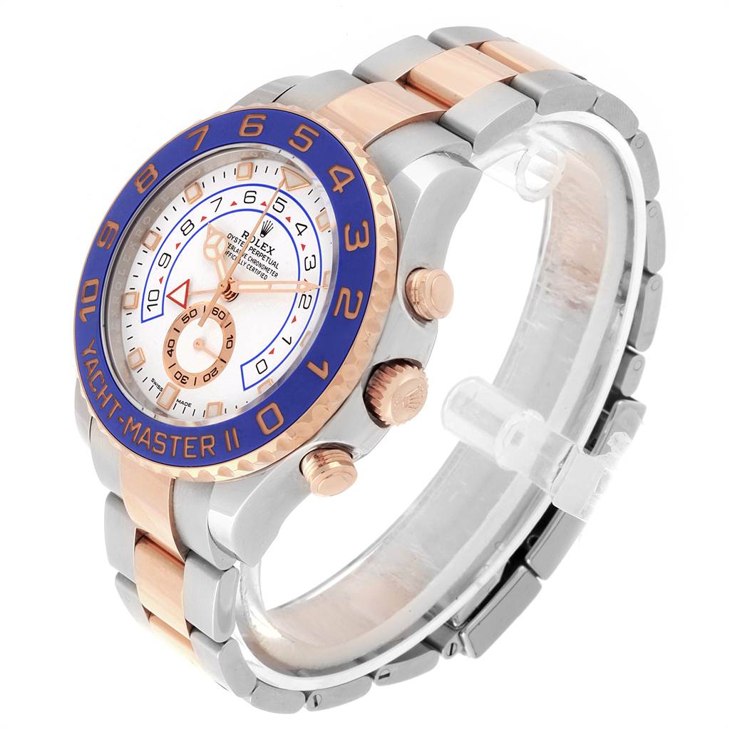 The Yacht-Master Rolex watch is shown at an angle highlighting its face, bezel, crown, and bracelet.