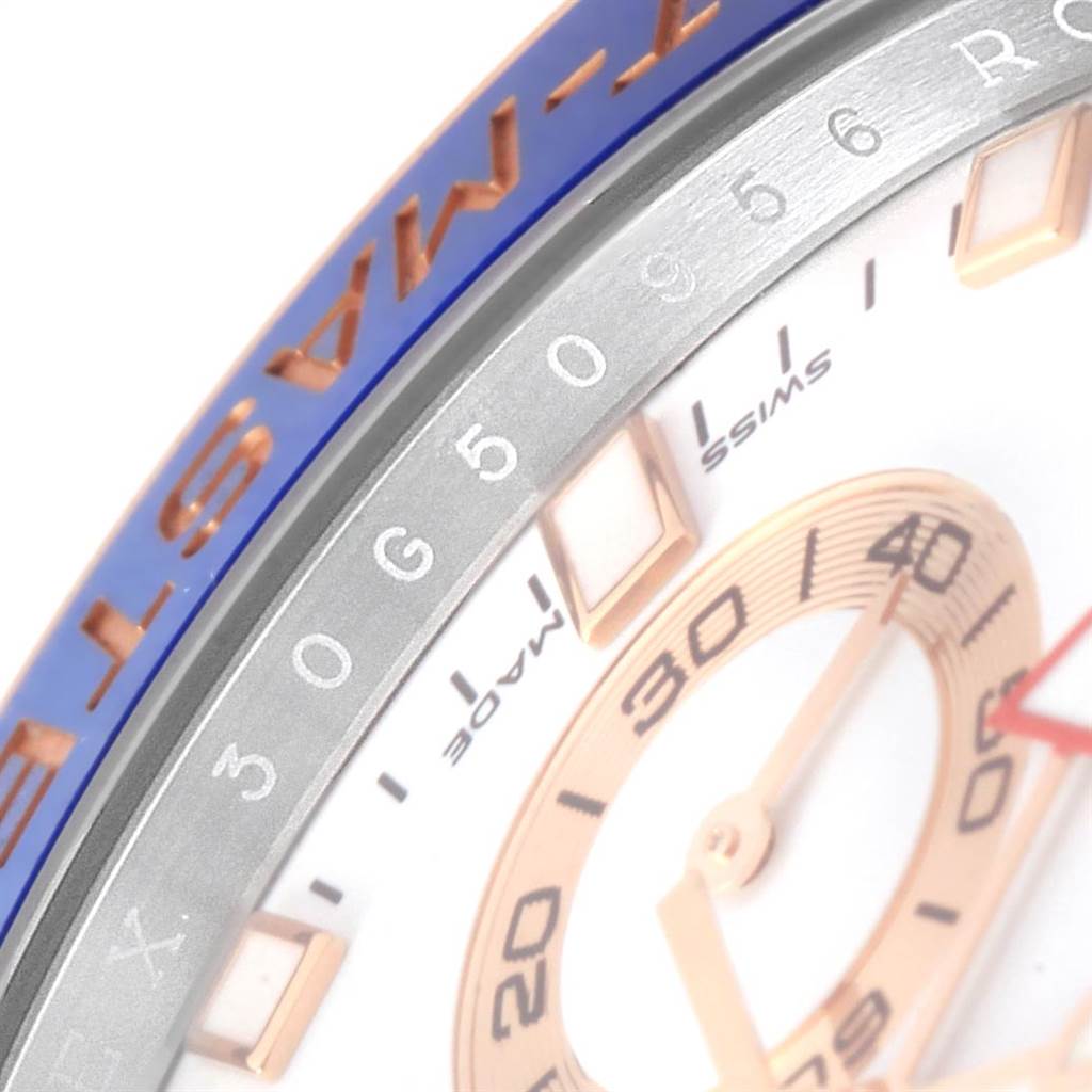 The image shows a close-up of the dial and bezel of a Rolex Yacht-Master 116681 Men
s Steel and Gold (two tone) White Dial 116681 Men
s Steel and Gold (two tone) White Dial watch, highlighting the numeral markings and part of the inner dial.