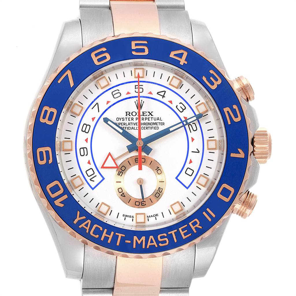 The image shows a Rolex Yacht-Master 116681 Men
s Steel and Gold (two tone) White Dial 116681 Men
s Steel and Gold (two tone) White Dial II watch from the front, featuring a blue bezel, white dial, and gold and silver bracelet.