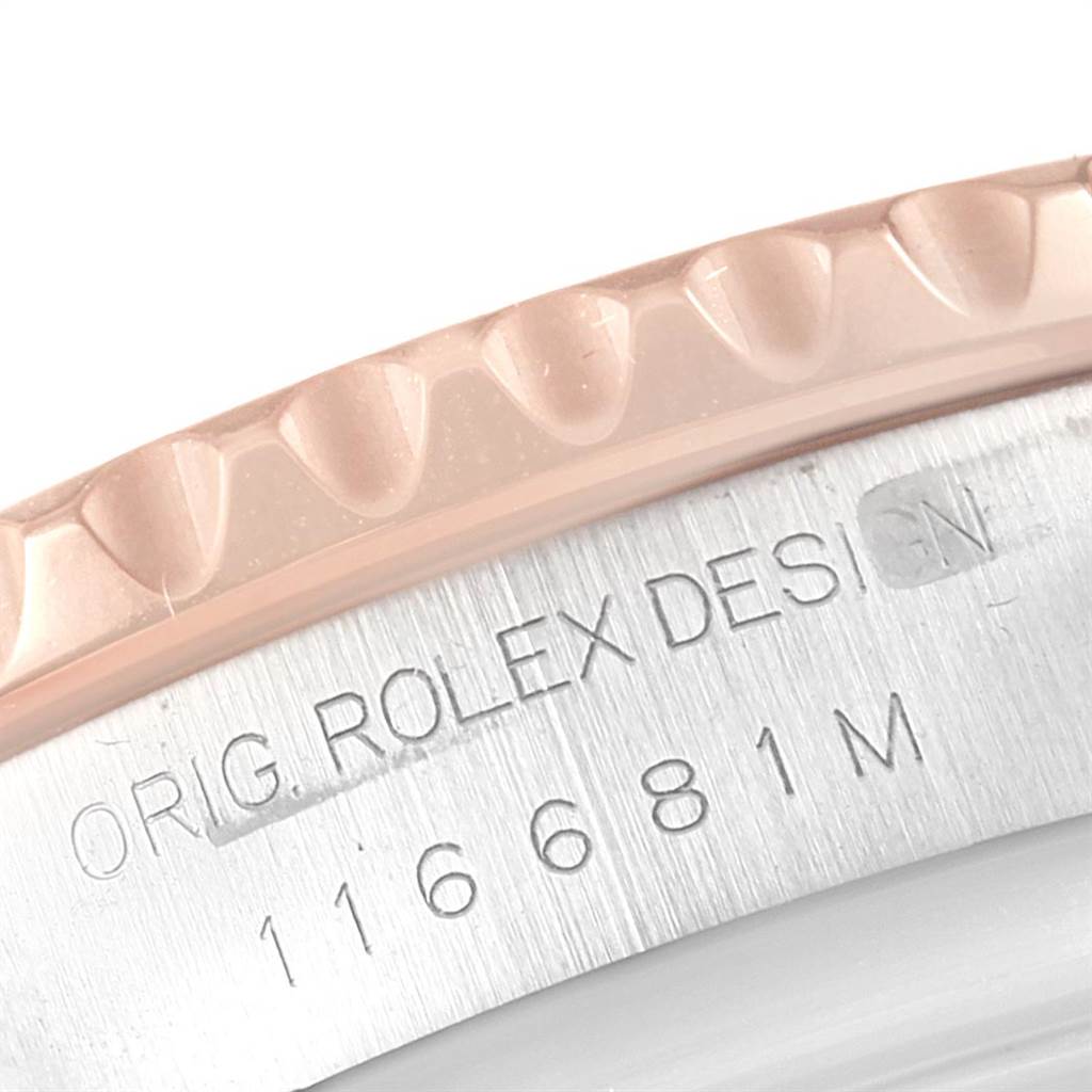 This close-up shows the bezel and engraved model number of the Rolex Yacht-Master 116681 Men
s Steel and Gold (two tone) White Dial 116681 Men
s Steel and Gold (two tone) White Dial watch.