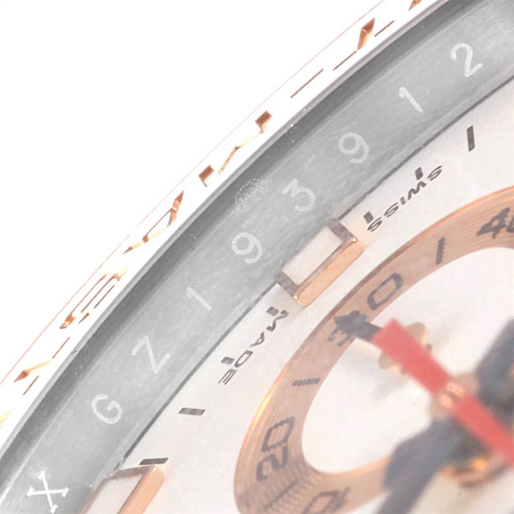 The image shows a close-up view of the dial and bezel of a Rolex Yacht-Master 116681 Men
s Steel and Gold (two tone) White Dial 116681 Men
s Steel and Gold (two tone) White Dial watch, focusing on the numerals and part of the second hand.