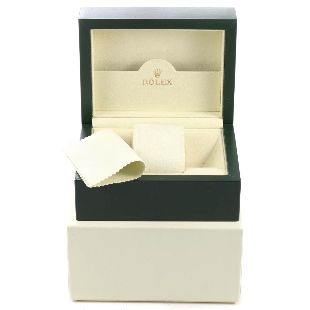 This image shows a Rolex Yacht-Master 16622 Men's Stainless Steel Silver Dial 16622 Men's Stainless Steel Silver Dial watch box and cream-colored cushion with a cleaning cloth.