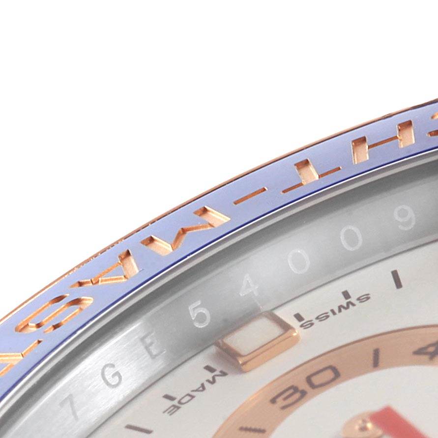 The image shows a close-up of the bezel and part of the dial of a Rolex Yacht-Master 116681 Men's Steel and Gold (two tone) White Dial 116681 Men's Steel and Gold (two tone) White Dial watch.