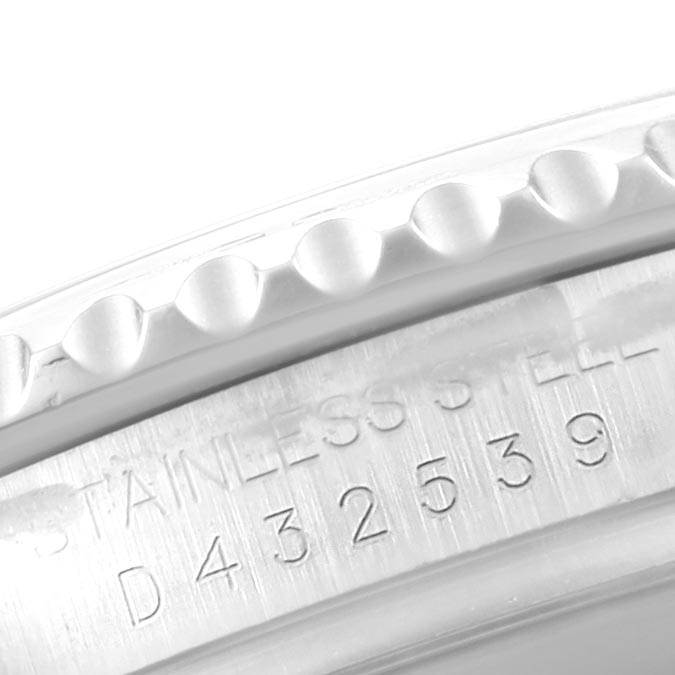 The image shows a close-up of the serial number and the fluted bezel of a Rolex Yacht-Master 16622 Men's Stainless Steel Silver Dial 16622 Men's Stainless Steel Silver Dial watch.
