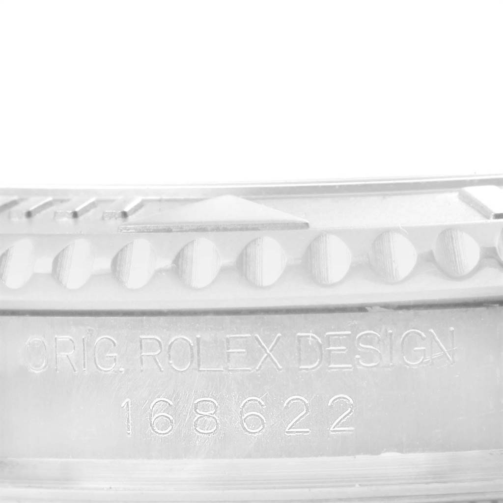 This close-up image of the Rolex Yacht-Master 168622 Men's Stainless Steel Silver Dial 168622 Men's Stainless Steel Silver Dial watch shows the bezel and the engraved model number 168622.