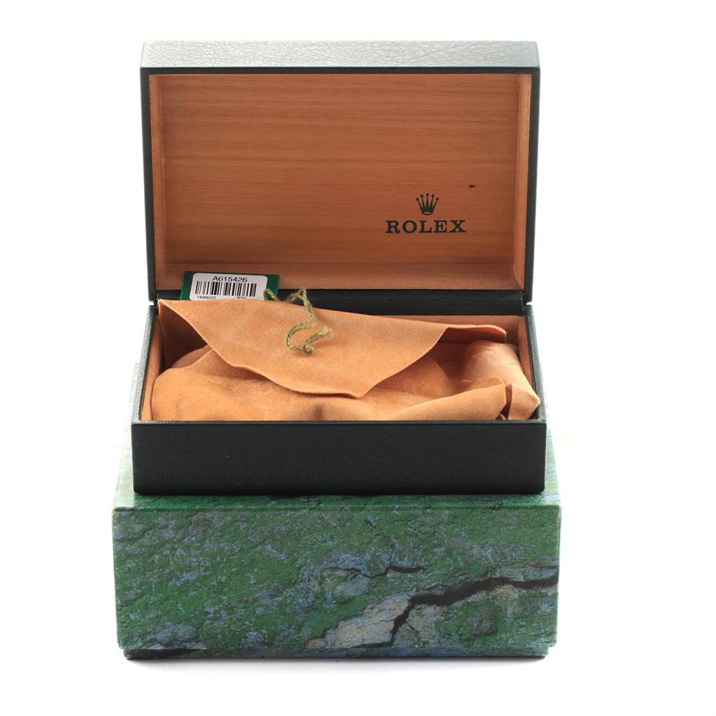 The image shows an open Rolex Yacht-Master 168622 Men's Stainless Steel Silver Dial 168622 Men's Stainless Steel Silver Dial watch box with an empty interior and a suede cloth inside.