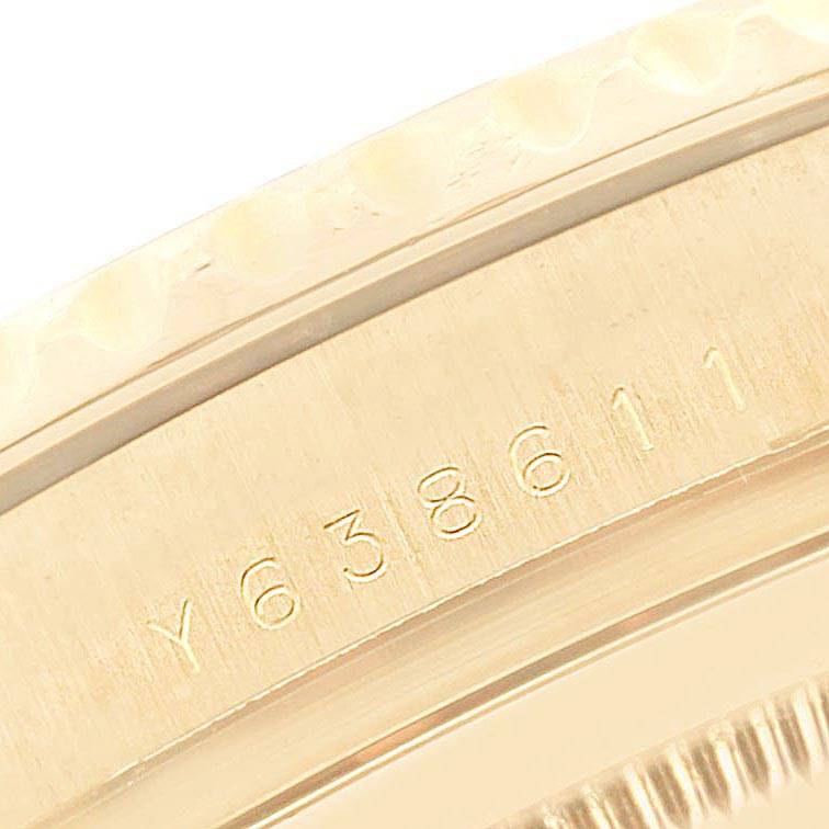 This close-up image shows the serial number on the gold case side of a Rolex Yacht-Master 16628 Men's Yellow Gold Mother of Pearl Dial 16628 Men's Yellow Gold Mother of Pearl Dial watch.