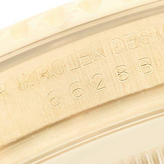 The image shows a close-up angle of the engraved inner bezel of a Rolex Yacht-Master 16628 Men's Yellow Gold Mother of Pearl Dial 16628 Men's Yellow Gold Mother of Pearl Dial watch.