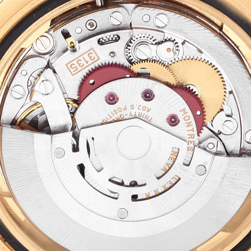 The image shows the internal mechanism of a Rolex Yacht-Master 16628 Men's Yellow Gold Mother of Pearl Dial 16628 Men's Yellow Gold Mother of Pearl Dial watch, including the gears and movement parts, viewed up close.