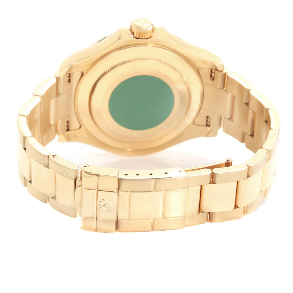 The image shows the back and bracelet of a Rolex Yacht-Master 16628 Men's Yellow Gold Mother of Pearl Dial 16628 Men's Yellow Gold Mother of Pearl Dial watch at an angle showcasing its gold case and clasp.