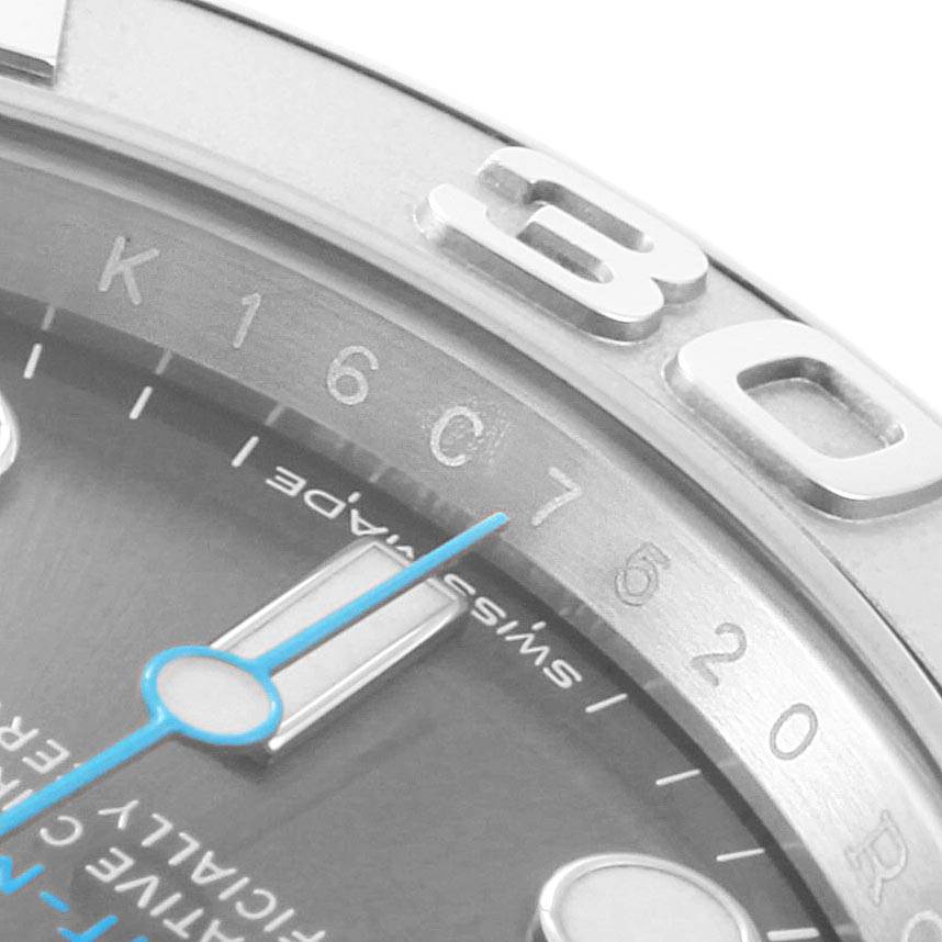 The image shows a close-up of the bezel and part of the dial of a Rolex Yacht-Master 116622 Men
s Stainless Steel Grey Dial 116622 Men
s Stainless Steel Grey Dial watch, highlighting the numbers and minute markers.
