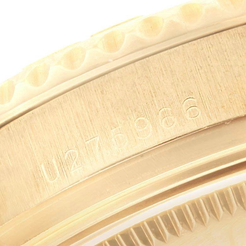 This close-up image shows the bezel and part of the case with a serial number from a Rolex Yacht-Master 68628 Men
s Yellow Gold Mother of Pearl Dial 68628 Men
s Yellow Gold Mother of Pearl Dial watch.