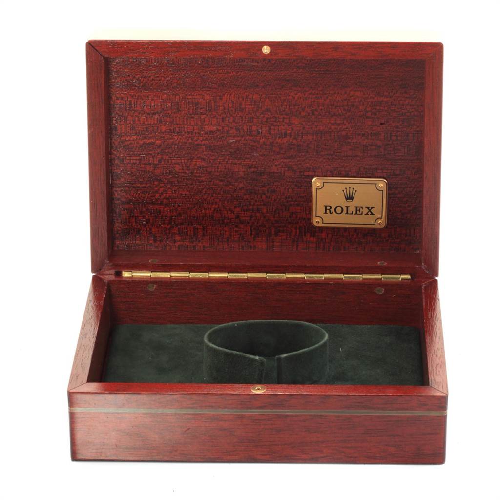 This image shows an open wooden Rolex Yacht-Master 68628 Men
s Yellow Gold Mother of Pearl Dial 68628 Men
s Yellow Gold Mother of Pearl Dial watch box with a gold label inside the lid.