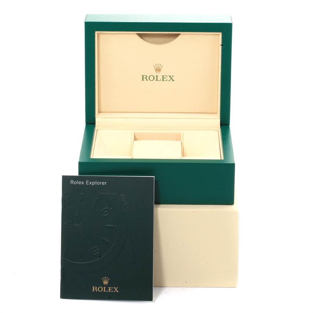 The image shows an open Rolex Yacht-Master 116622 Men
s Stainless Steel Blue Dial 116622 Men
s Stainless Steel Blue Dial watch box and a booklet positioned at an angle in front of it.