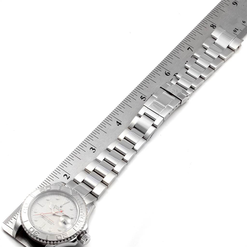 The image shows a Rolex Yacht-Master 16622 Men's Stainless Steel Silver Dial 16622 Men's Stainless Steel Silver Dial watch laid next to a ruler, highlighting the bracelet and watch face.