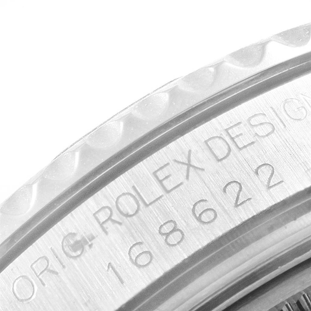 The image shows a close-up of the bezel and engraving on the Rolex Yacht-Master 168622 Men
s Stainless Steel Silver Dial 168622 Men
s Stainless Steel Silver Dial watch.