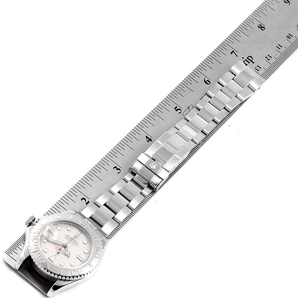 This image shows the top view of a Rolex Yacht-Master 168622 Men's Stainless Steel Silver Dial 168622 Men's Stainless Steel Silver Dial watch next to a measuring scale, highlighting the dial and bracelet.