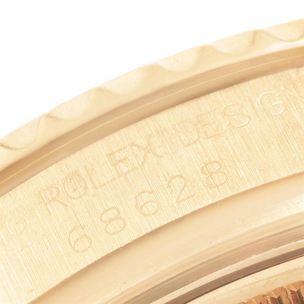 This image shows a close-up of the bezel and case of a Rolex Yacht-Master 68628 Yellow Gold Blue Dial 68628 Yellow Gold Blue Dial watch, highlighting the model number and textured bezel edge.