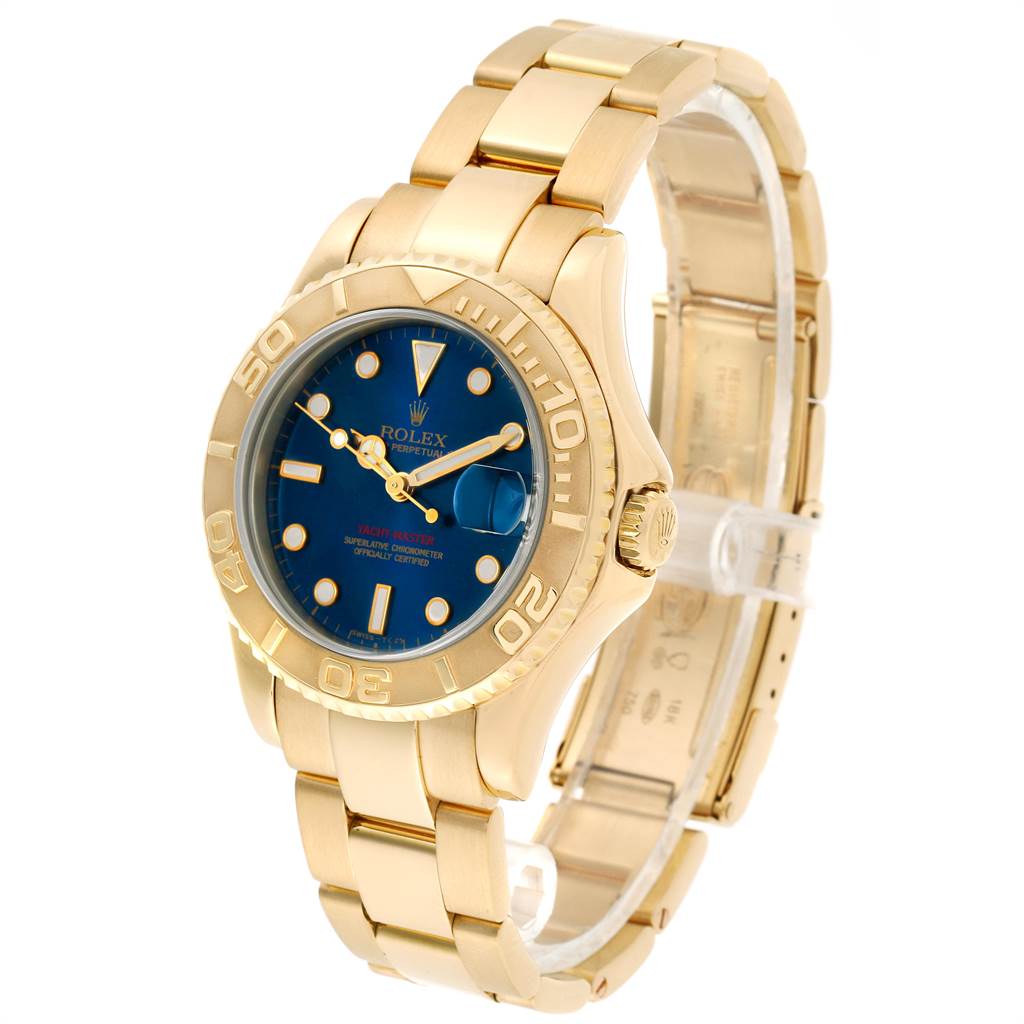 This Rolex Yacht-Master 68628 Yellow Gold Blue Dial 68628 Yellow Gold Blue Dial watch is shown at a 3/4 angle, highlighting the gold bracelet, blue dial, and bezel.
