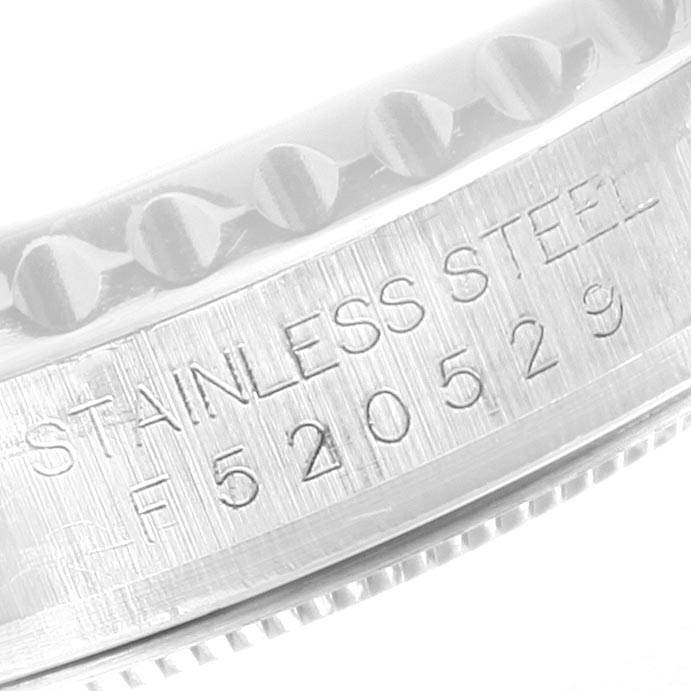 This close-up image shows the engraved serial number and "stainless steel" text on the case of the Rolex Yacht-Master 16622 Men's Stainless Steel Silver Dial 16622 Men's Stainless Steel Silver Dial watch.