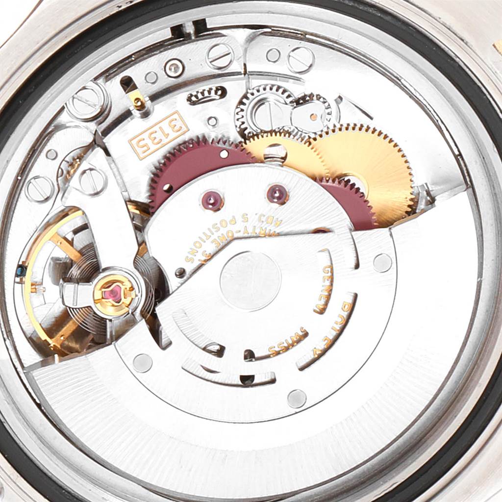 The image shows a close-up view of the Rolex Yacht-Master 16623 Men's Stainless Steel Blue Dial 16623 Men's Stainless Steel Blue Dial watch's mechanical movement, highlighting the internal gears and rotor.