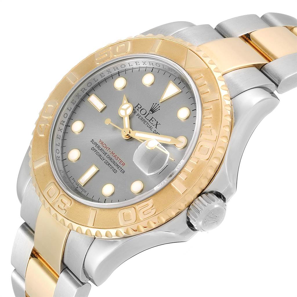 This image shows a side angle of a Rolex Yacht-Master 16623 Men's Steel and Gold (two tone) Grey Dial 16623 Men's Steel and Gold (two tone) Grey Dial watch, highlighting its gold bezel, dial, crown, and two-tone bracelet.