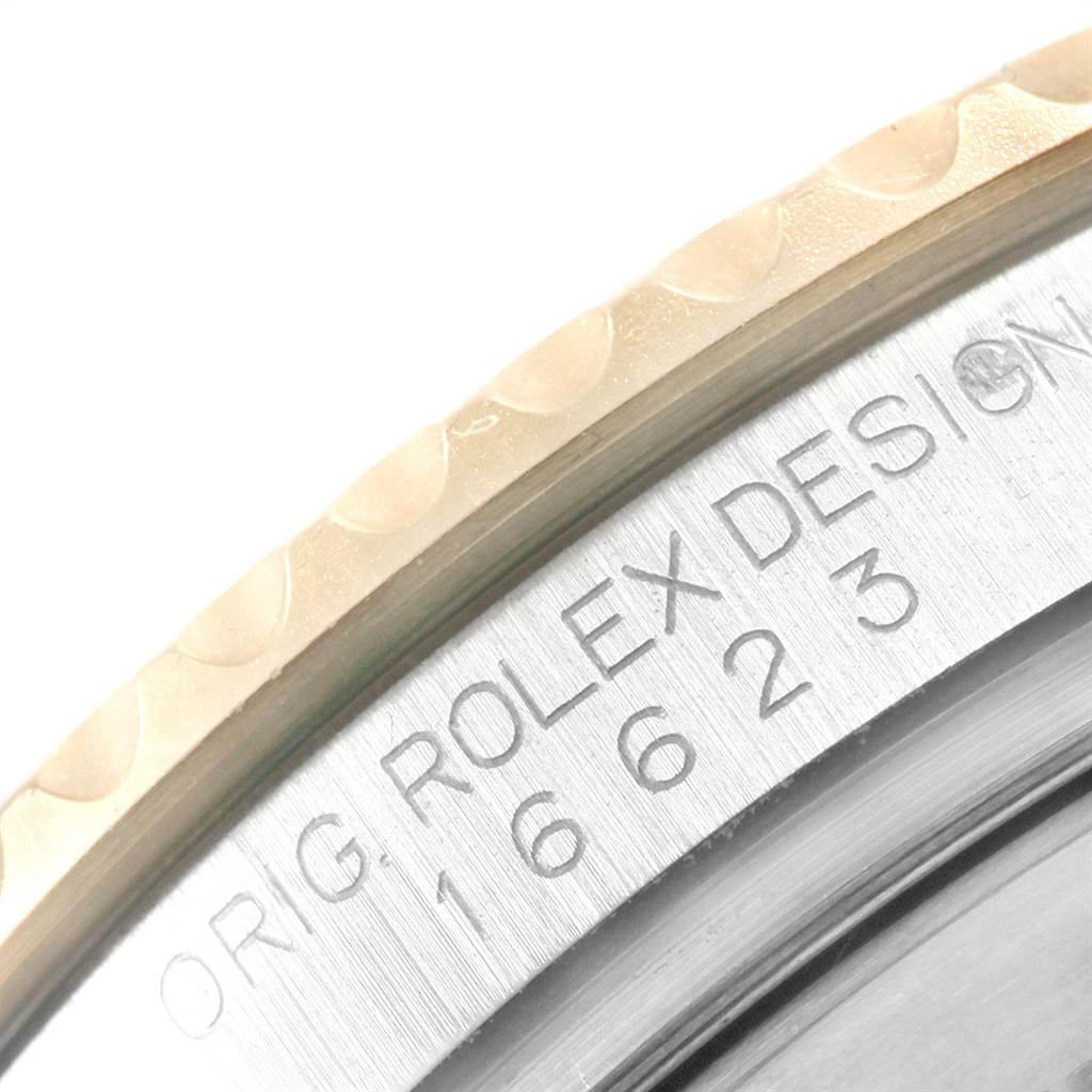 This close-up image shows the bezel and part of the engraved case of the Rolex Yacht-Master 16623 Men's Steel and Gold (two tone) Grey Dial 16623 Men's Steel and Gold (two tone) Grey Dial watch model.