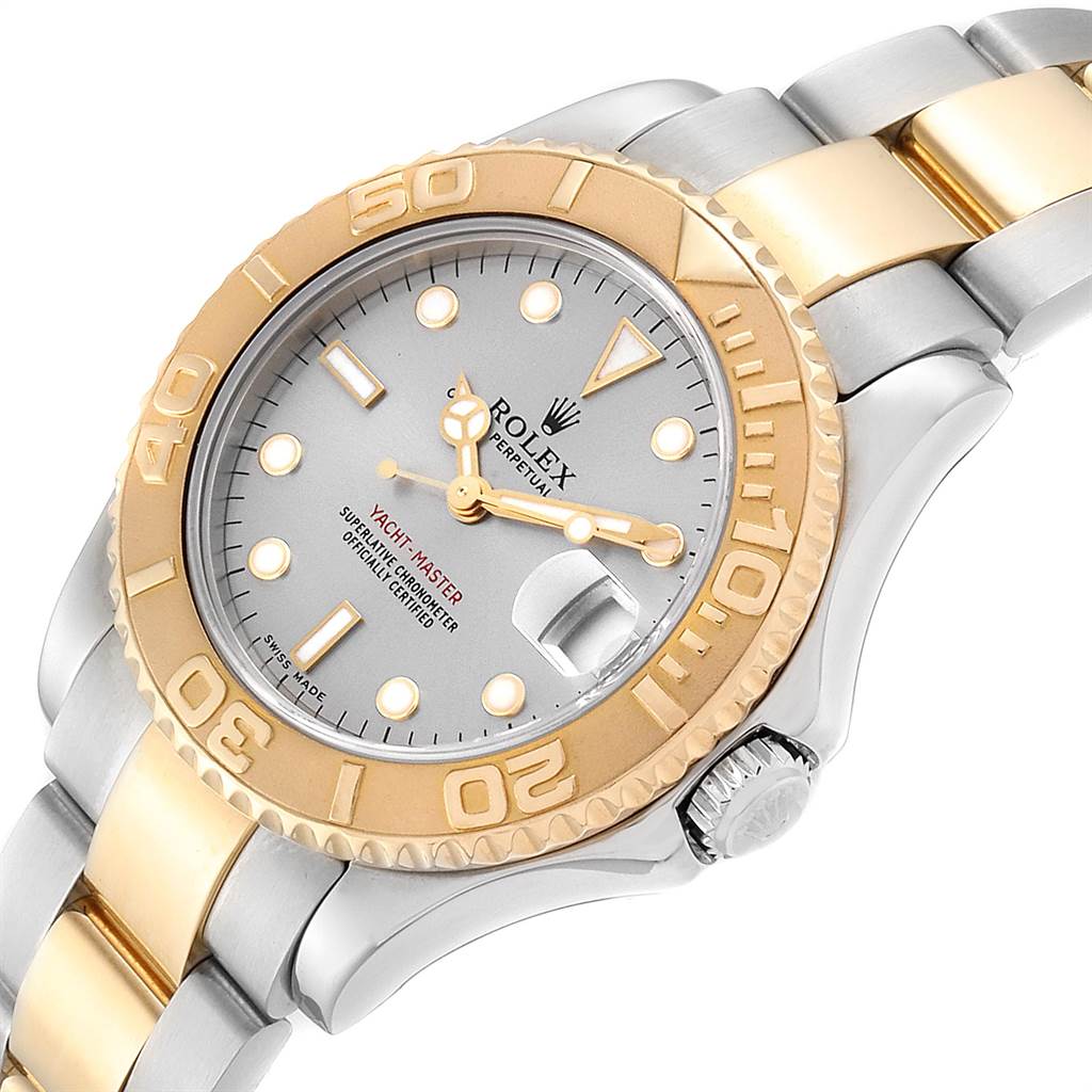 The image shows a close-up angle of a Rolex Yacht-Master 168623 Men
s Steel and Gold (two tone) Grey Dial 168623 Men
s Steel and Gold (two tone) Grey Dial watch, highlighting its face, bezel, crown, and part of the bracelet.