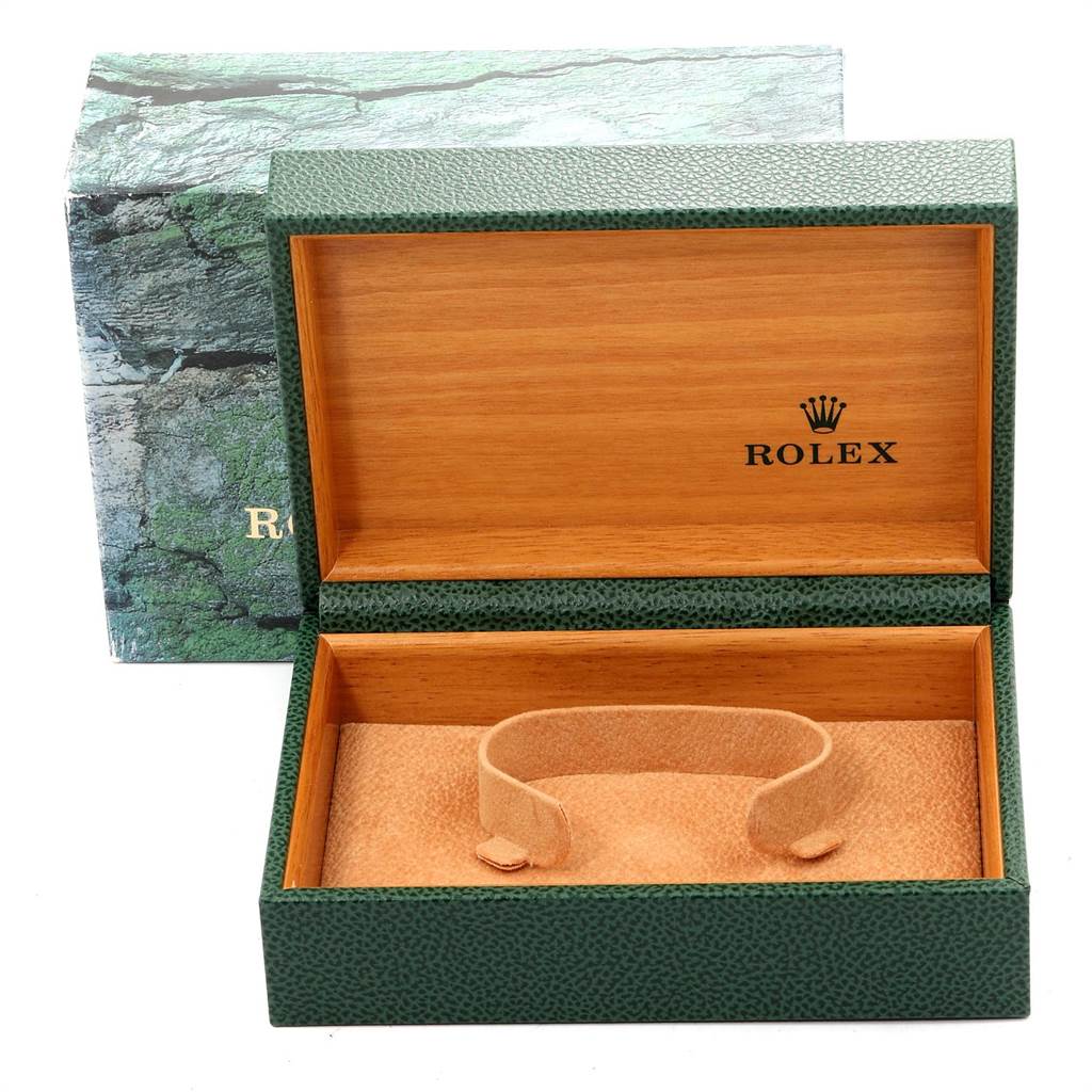 This image shows an empty Rolex Yacht-Master 168623 Men
s Steel and Gold (two tone) Grey Dial 168623 Men
s Steel and Gold (two tone) Grey Dial watch box, displaying the green exterior and wooden interior.