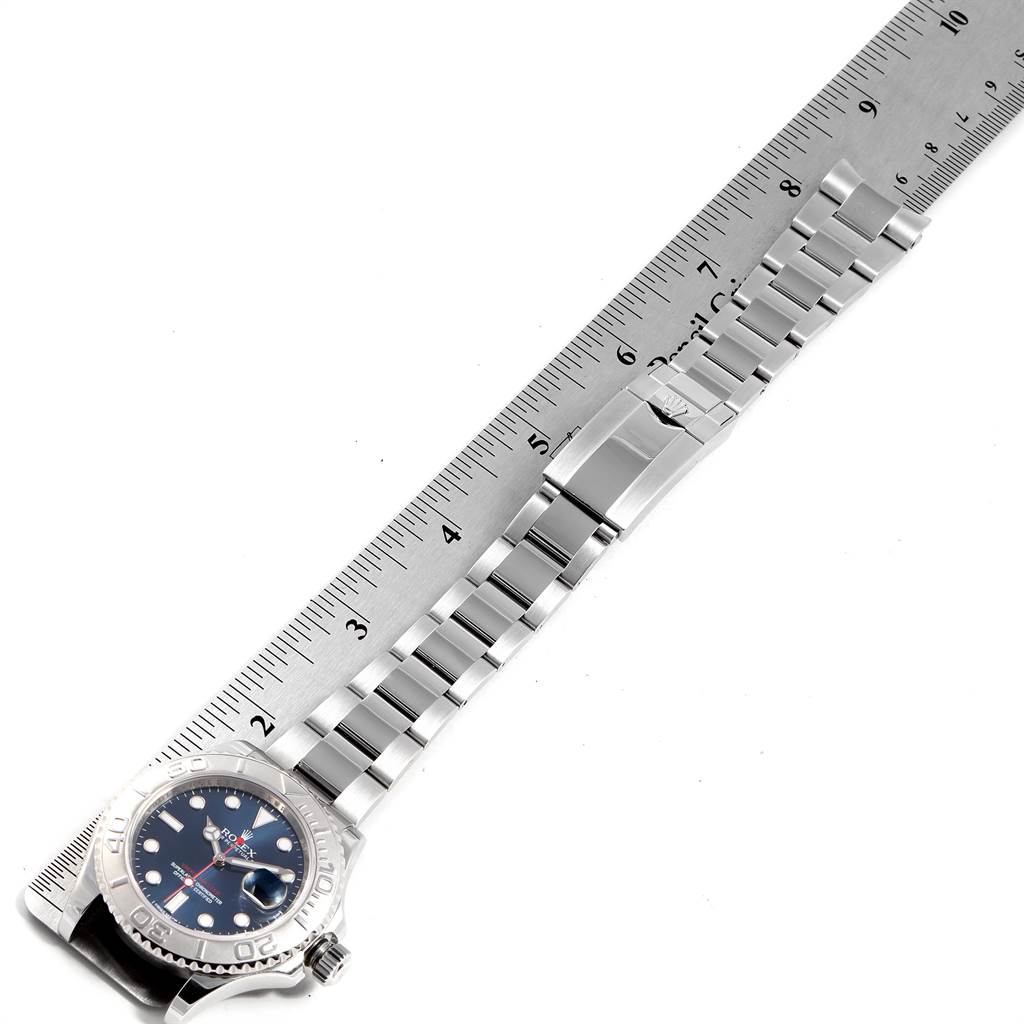 The image shows a top-down view of a Rolex Yacht-Master 116622 Men's Stainless Steel Blue Dial 116622 Men's Stainless Steel Blue Dial watch with its full metal bracelet and a ruler for scale.