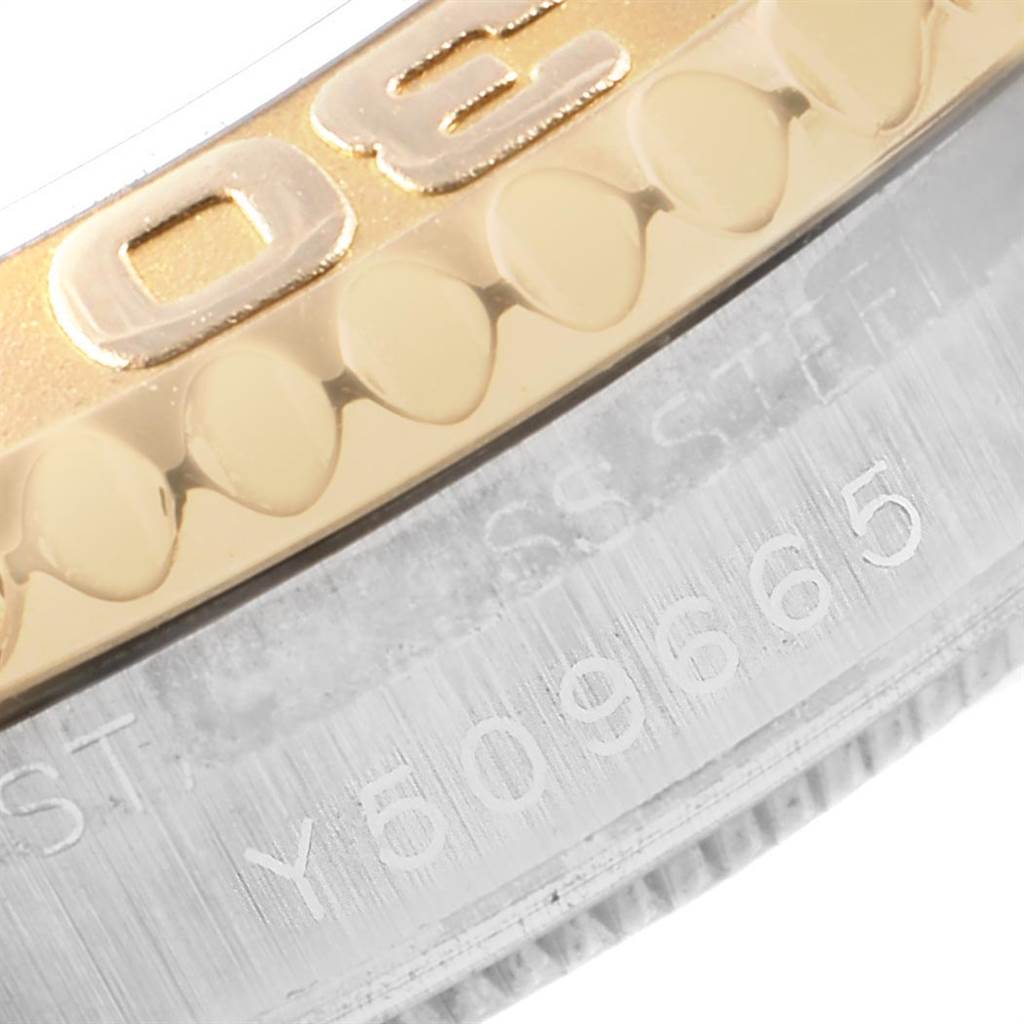 Close-up shot of the bezel and case of a Rolex Yacht-Master 168623 Men's Steel and Gold (two tone) Blue Dial 168623 Men's Steel and Gold (two tone) Blue Dial watch, showing engraving details.