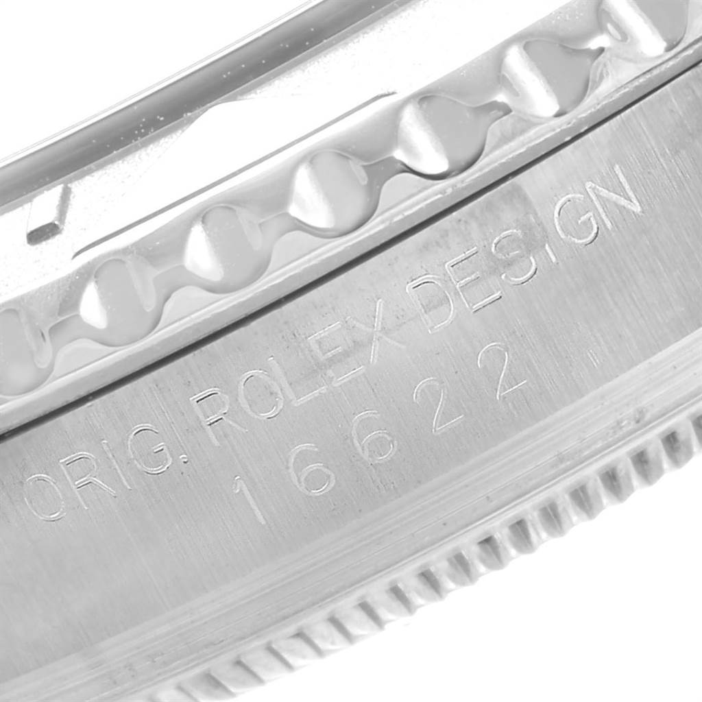 The image shows a close-up of the engraved bezel and case of a Rolex Yacht-Master 16622 Men's Stainless Steel Silver Dial 16622 Men's Stainless Steel Silver Dial model.