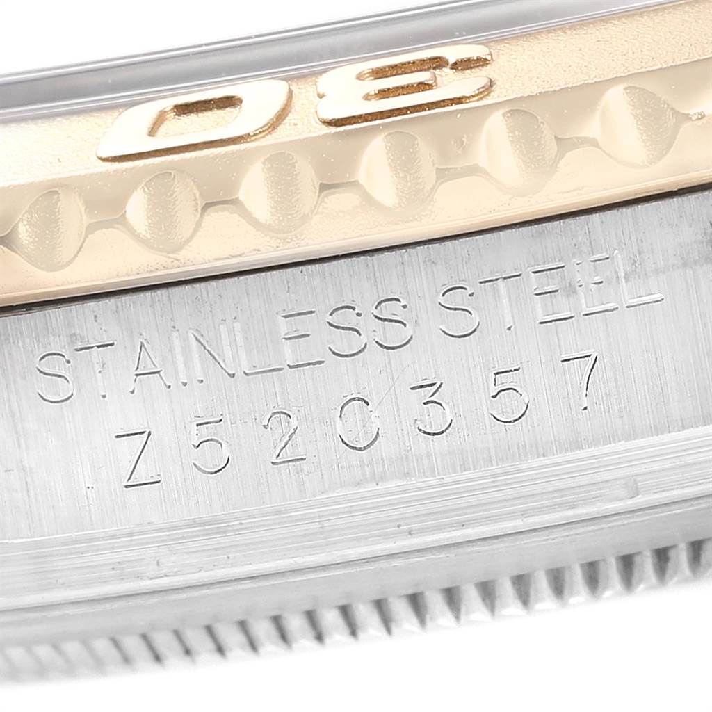 The image shows a close-up of the serial number and stainless steel engravings on the bezel of a Rolex Yacht-Master 16623 Men's Stainless Steel Champagne Dial 16623 Men's Stainless Steel Champagne Dial watch.