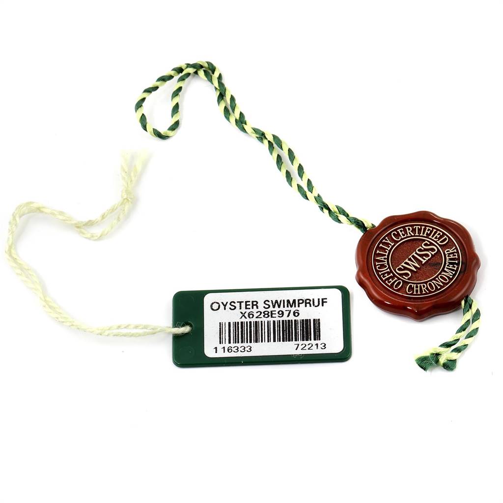 The image shows the green and white string tag and red chronometer seal for a Rolex Yacht-Master 116681 Men
s Steel and Gold (two tone) White Dial 116681 Men
s Steel and Gold (two tone) White Dial watch.