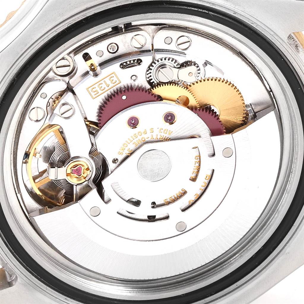 The image shows a close-up view of the movement inside the Rolex Yacht-Master 16623 Men's Stainless Steel Blue Dial 16623 Men's Stainless Steel Blue Dial watch, highlighting its intricate components and gears.