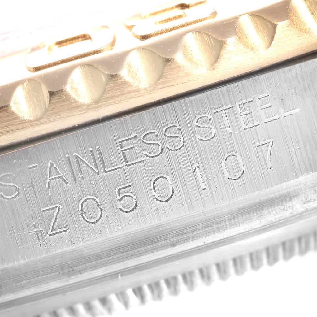 Close-up angle of the Rolex Yacht-Master 16623 Men's Stainless Steel Blue Dial 16623 Men's Stainless Steel Blue Dial model, showing the engraved stainless steel and part of the bezel.