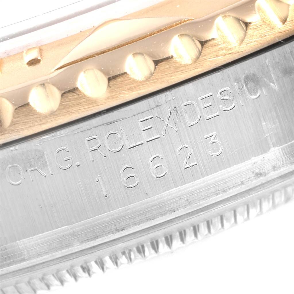 The image shows a close-up of the side of a Yacht-Master Rolex watch, highlighting the bezel and engraved model number 16623.