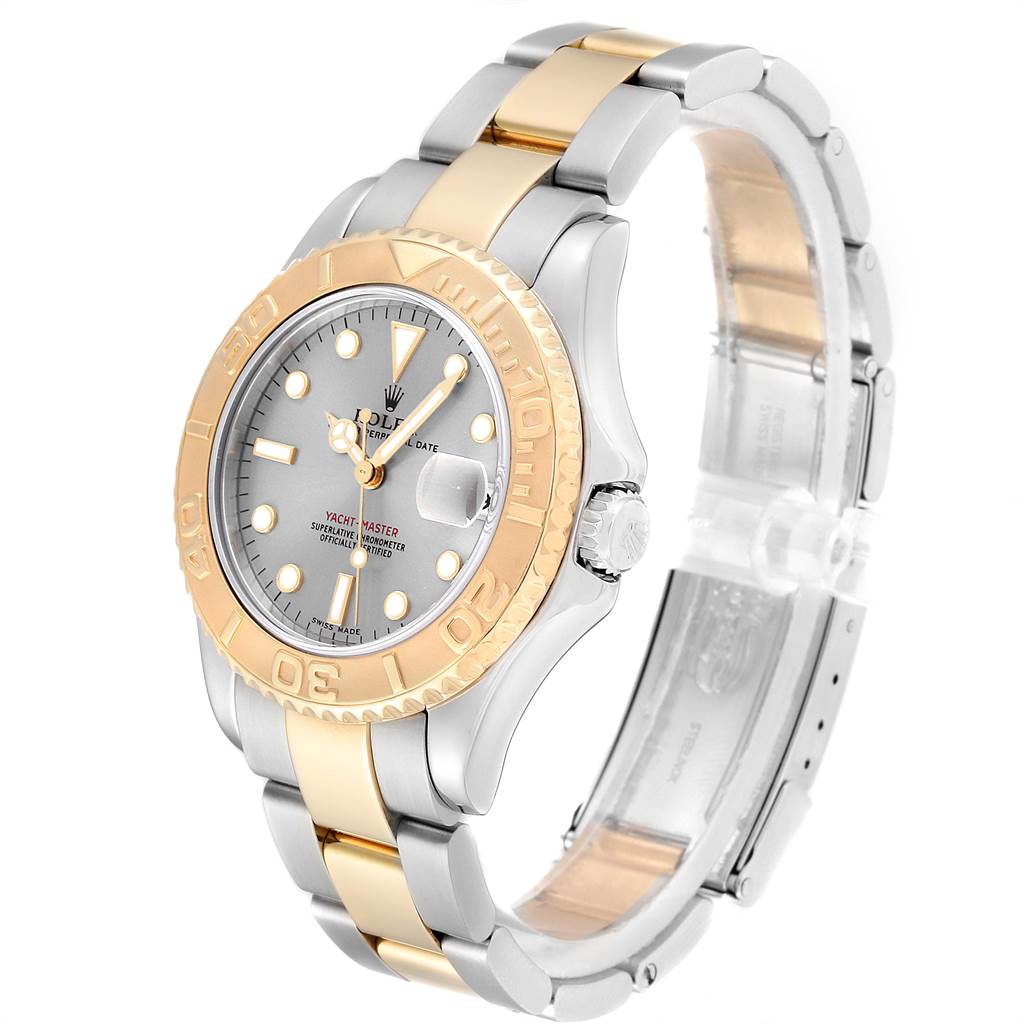 The image shows a Rolex Yacht-Master 168623 Men
s Steel and Gold (two tone) Grey Dial 168623 Men
s Steel and Gold (two tone) Grey Dial watch at an oblique angle, highlighting its dial, bezel, bracelet, and clasp.