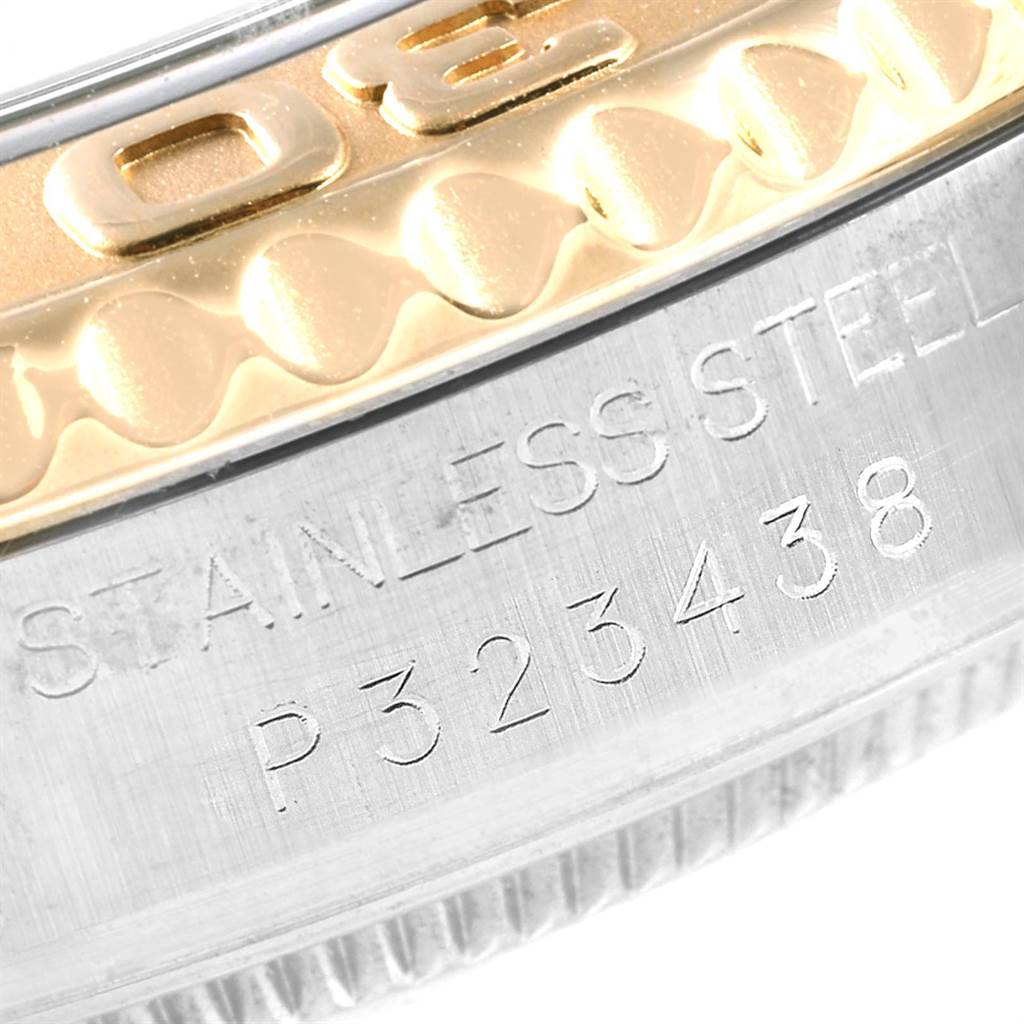 This close-up image shows the side view of the bezel and case back engraving on a Rolex Yacht-Master 168623 Men
s Steel and Gold (two tone) Grey Dial 168623 Men
s Steel and Gold (two tone) Grey Dial watch.