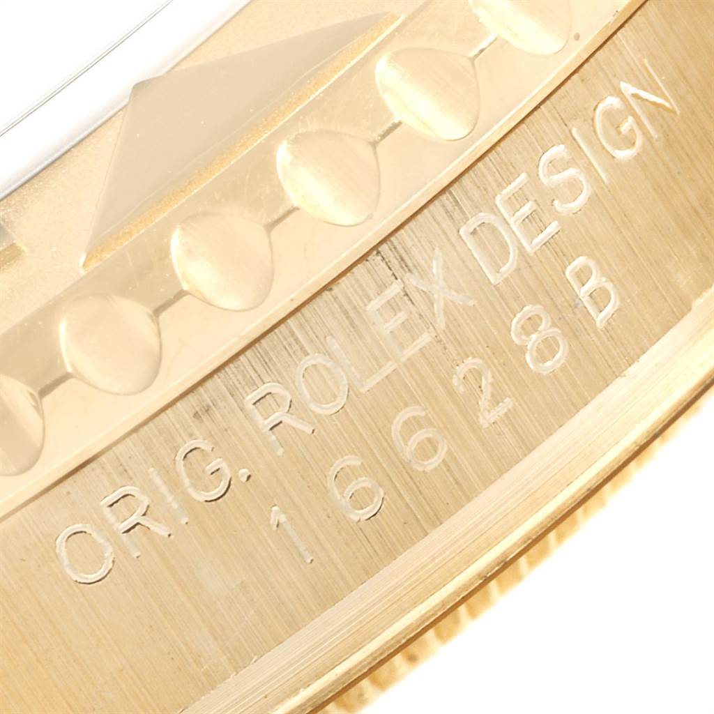 This close-up image shows a portion of the bezel and the engravings on the side of a Rolex Yacht-Master 16628 Men
s Yellow Gold Mother of Pearl Dial 16628 Men
s Yellow Gold Mother of Pearl Dial watch.