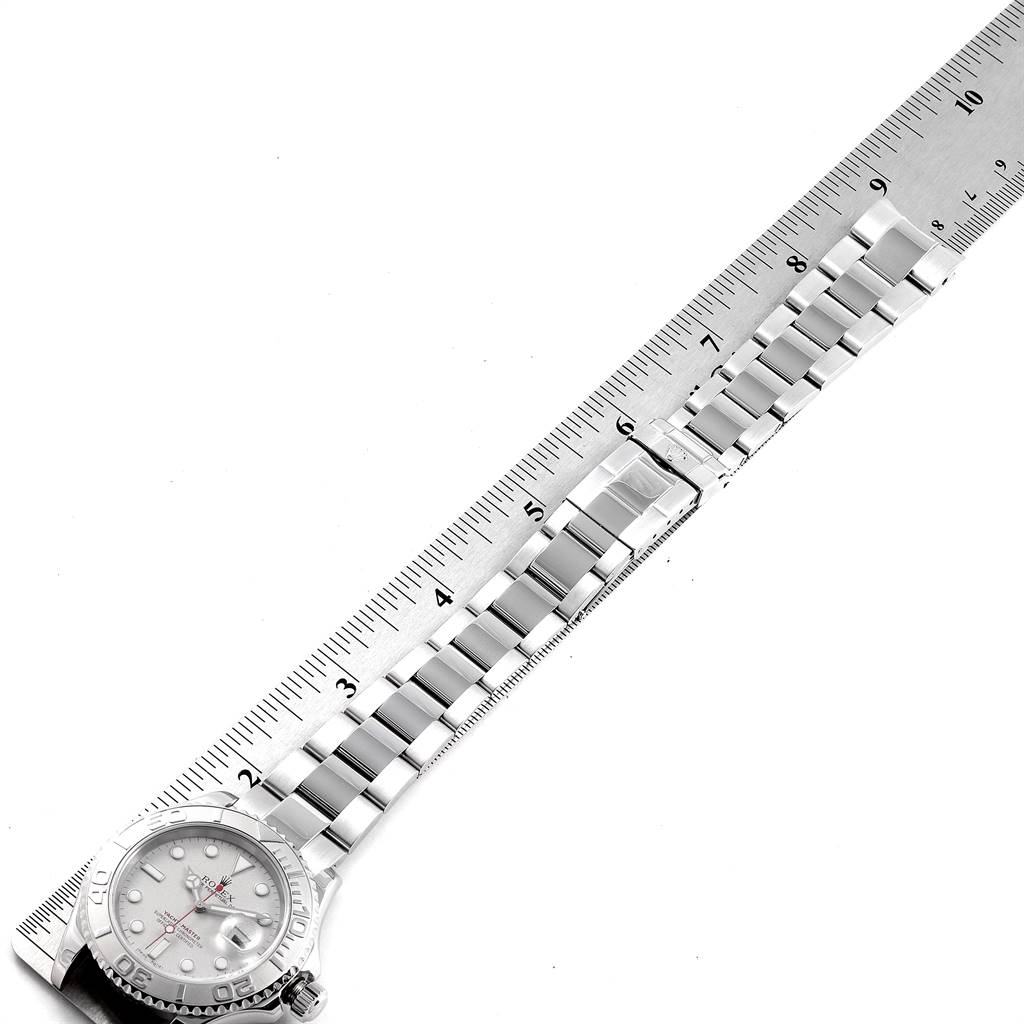 The image shows a Rolex Yacht-Master 16622 Men's Stainless Steel Silver Dial 16622 Men's Stainless Steel Silver Dial watch laid flat alongside a ruler, highlighting the bracelet and part of the watch face.