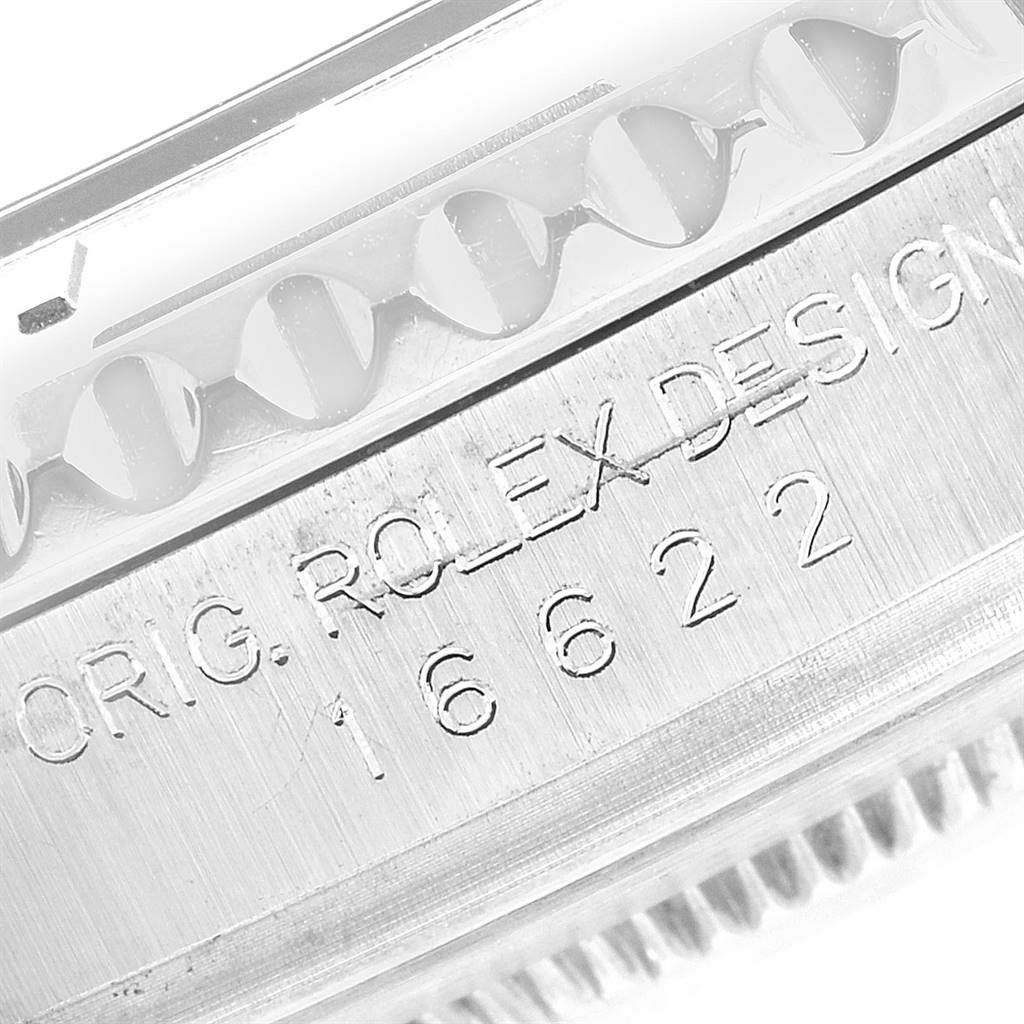 This close-up image shows the side engraving and fluted bezel of a Rolex Yacht-Master 16622 Men's Stainless Steel Silver Dial 16622 Men's Stainless Steel Silver Dial watch model 16622.