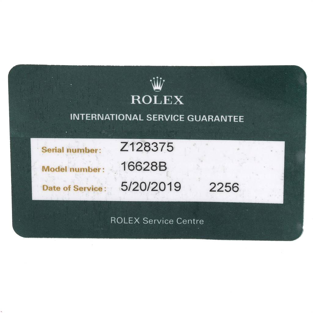 This image shows a service guarantee card for the Rolex Yacht-Master 16628 Men
s Yellow Gold Mother of Pearl Dial 16628 Men
s Yellow Gold Mother of Pearl Dial model 16628B, including the serial number and service date.