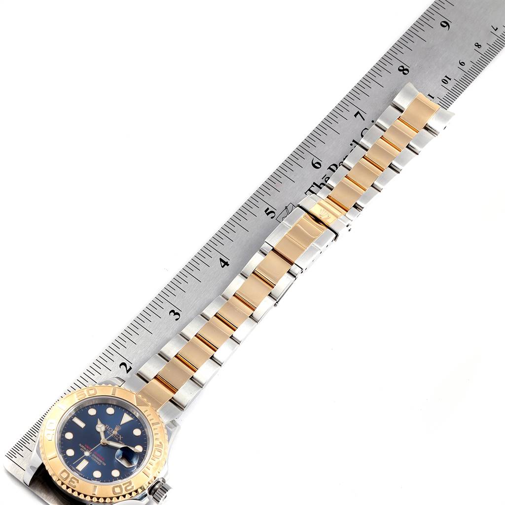The image shows the Rolex Yacht-Master 16623 Men's Stainless Steel Blue Dial 16623 Men's Stainless Steel Blue Dial watch laid flat next to a ruler to measure the band length.