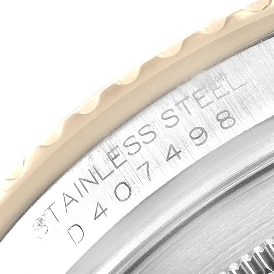 This close-up image shows the side and engraved serial number of the Rolex Yacht-Master 16623 Men's Stainless Steel Grey Dial 16623 Men's Stainless Steel Grey Dial watch's stainless steel case.