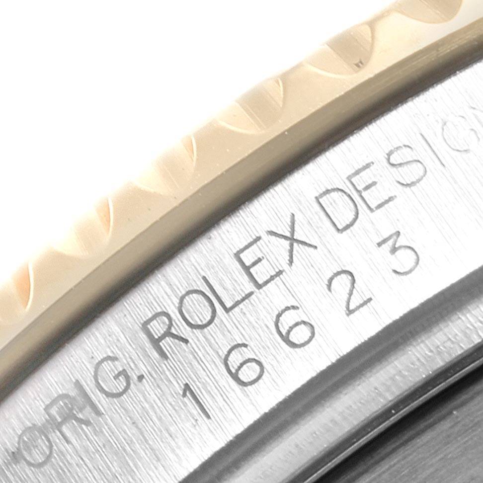 The image shows a close-up of the engraved bezel and case edge of a Rolex Yacht-Master 16623 Men's Stainless Steel Mother of Pearl Dial 16623 Men's Stainless Steel Mother of Pearl Dial watch.