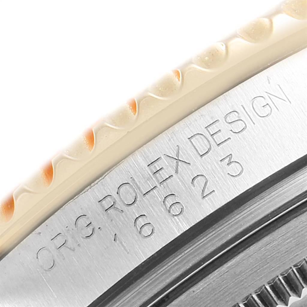 This close-up image shows the bezel and serial number engravings on the side of a Rolex Yacht-Master 16623 Men's Stainless Steel Blue Dial 16623 Men's Stainless Steel Blue Dial watch.