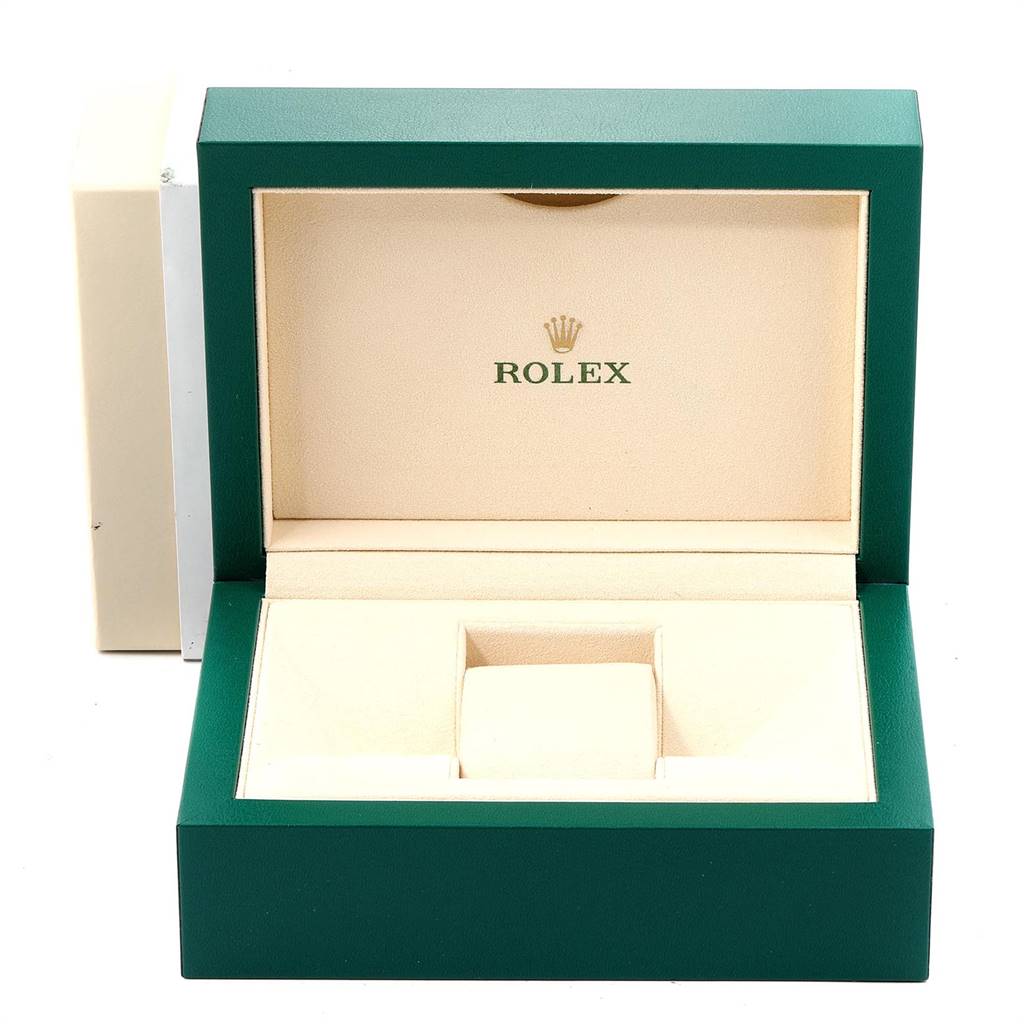 This image shows an open Rolex Yacht-Master 16623 Men's Stainless Steel Blue Dial 16623 Men's Stainless Steel Blue Dial watch box from a front angle, revealing its cream interior and green outer case.
